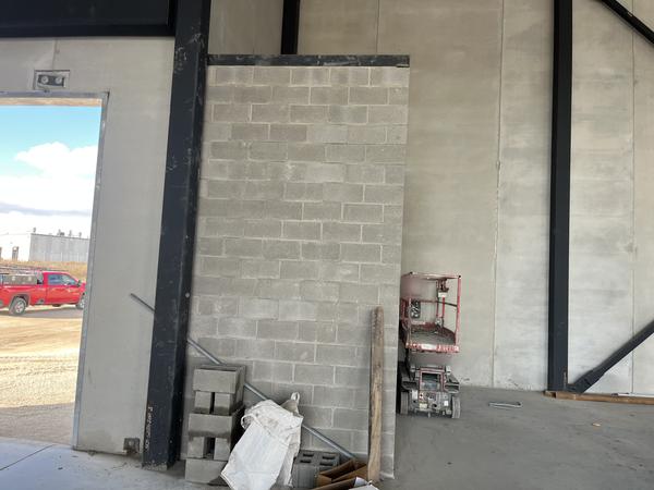 Block infill wall between steel columns, commercial