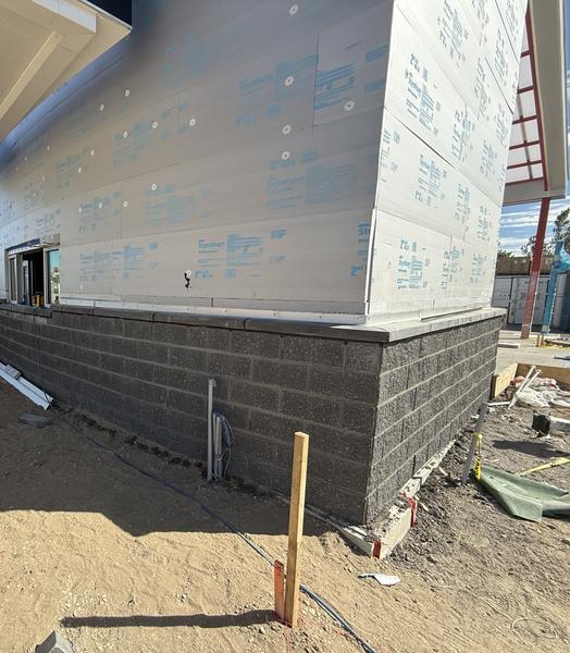 Block base corner under rigid insulation