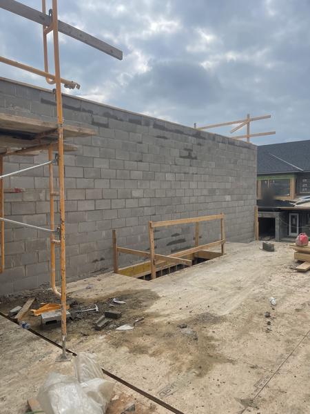 Block wall above a deck