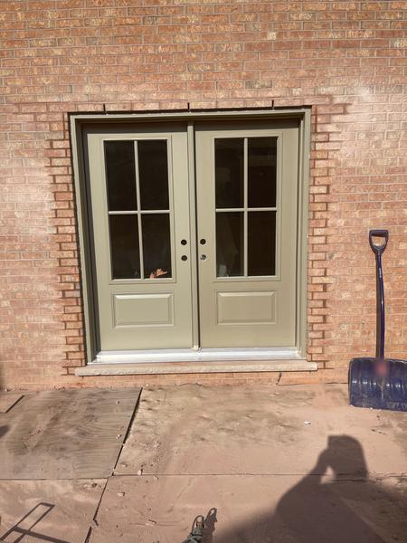 Brick veneer around a double door