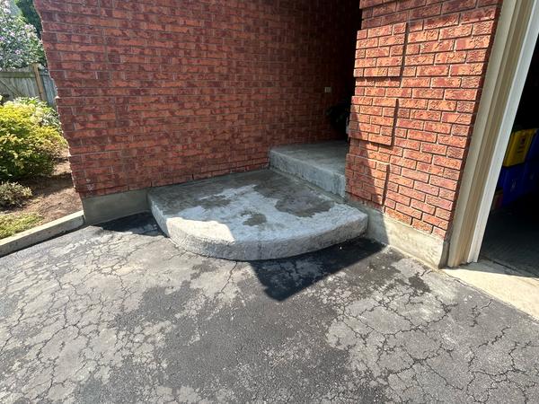 Brick entry with parged foundation