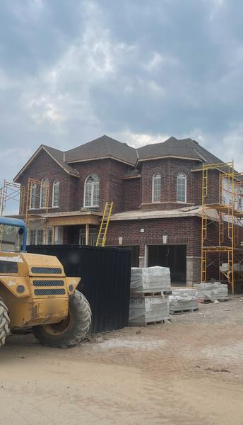 Brick veneer with scaffolding, two-storey home