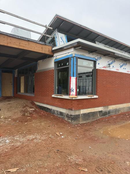 Brick veneer at a corner bay window