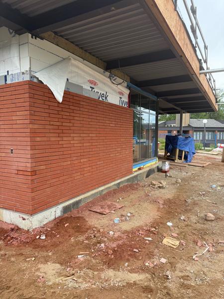 Brick veneer corner under the roof overhang