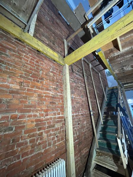 Interior brick wall with timber shoring