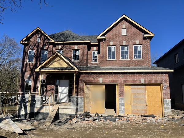 Red brick veneer, two-storey home
