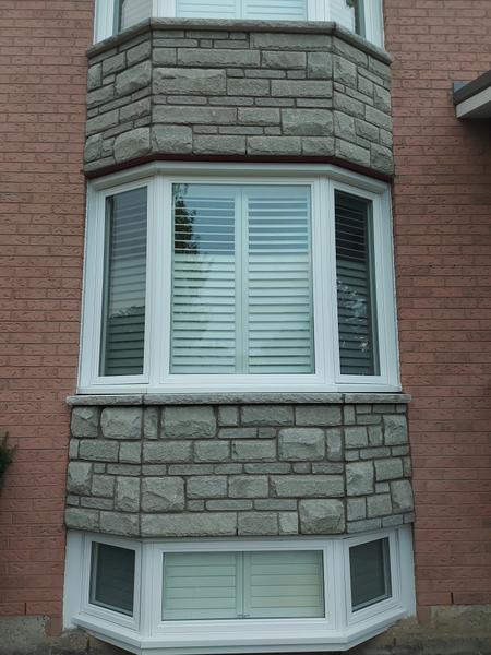 Stone veneer around a bay window